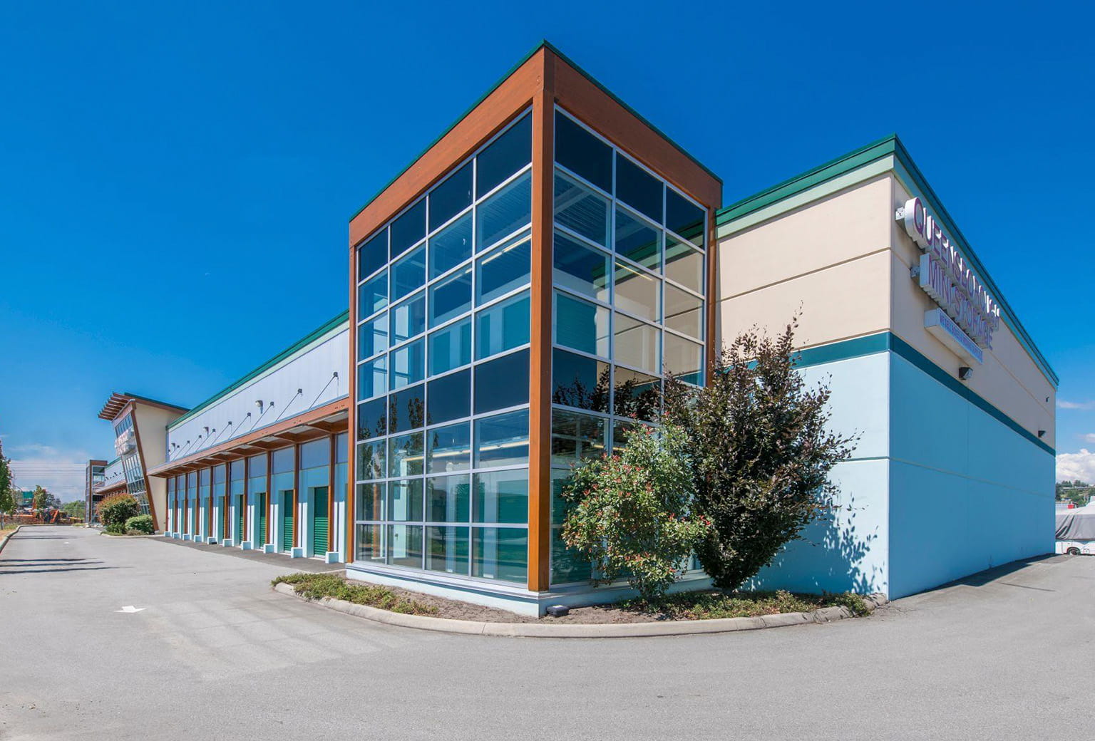 Modern self-storage facility with orange roll-up doors