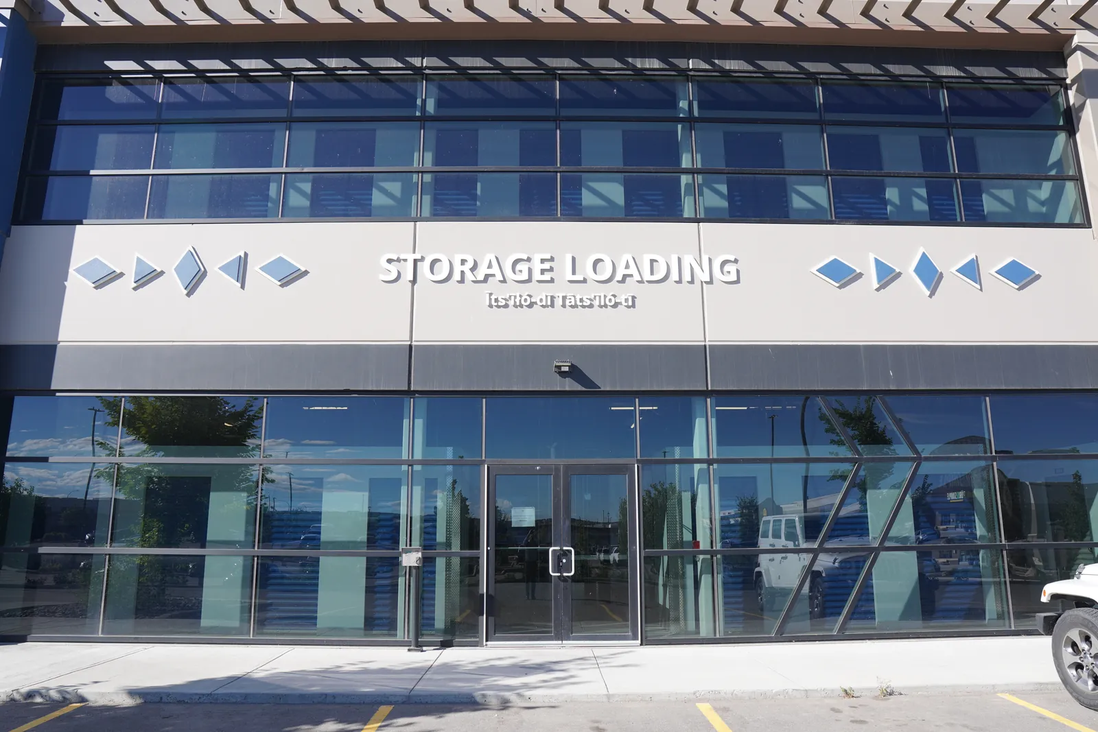 glass storage frontage with 'STORAGE LOADING' band, straight-on