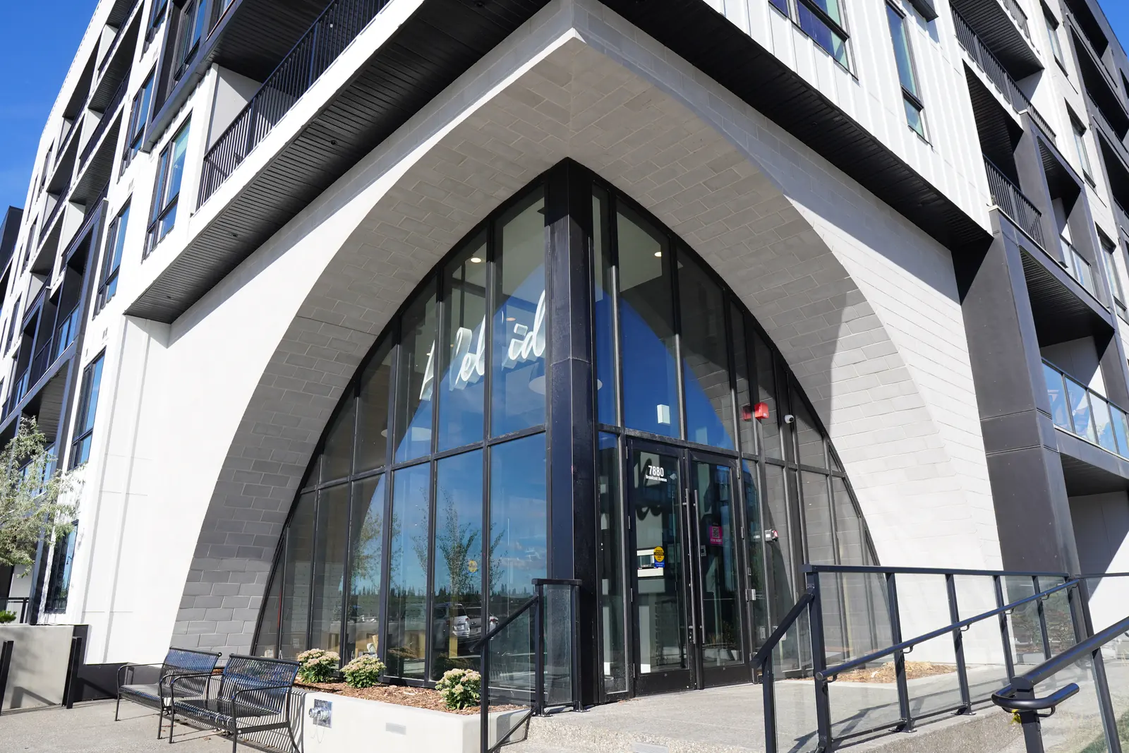 arched glazed entrance, close, white stone